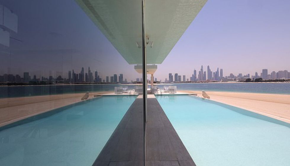 One mansion for sale has six bedrooms, private access to the beach, a showroom for seven cars, a spa, a swimming pool with a view of downtown Dubai and accommodation for employees on site