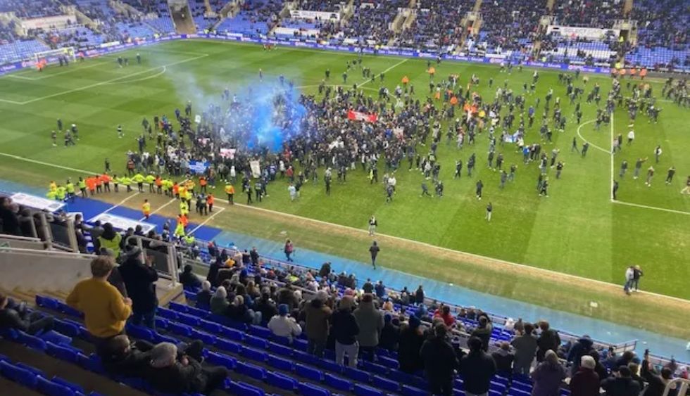 Reading fans stormed the pitch during their clash with Port Vale 