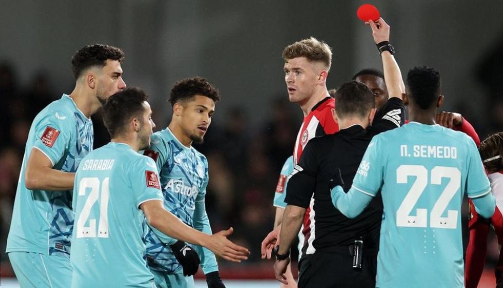 Joao Gomes (centre left) was sent off after just nine minutes of the game at Brentford Community Stadium
