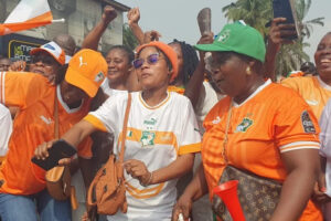 Fans dance in the street as they celebrate the Elephants' third Afcon win