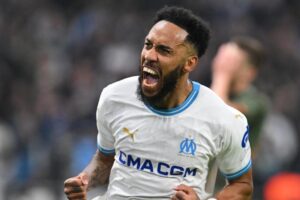 Marseille's French-Gabonese forward #10 Pierre-Emerick Aubameyang celebrates scoring his team's first goal during the UEFA Europa League knockout round play-off second leg football match between Olympique de Marseille and Shakhtar Donetsk at the Velodrome