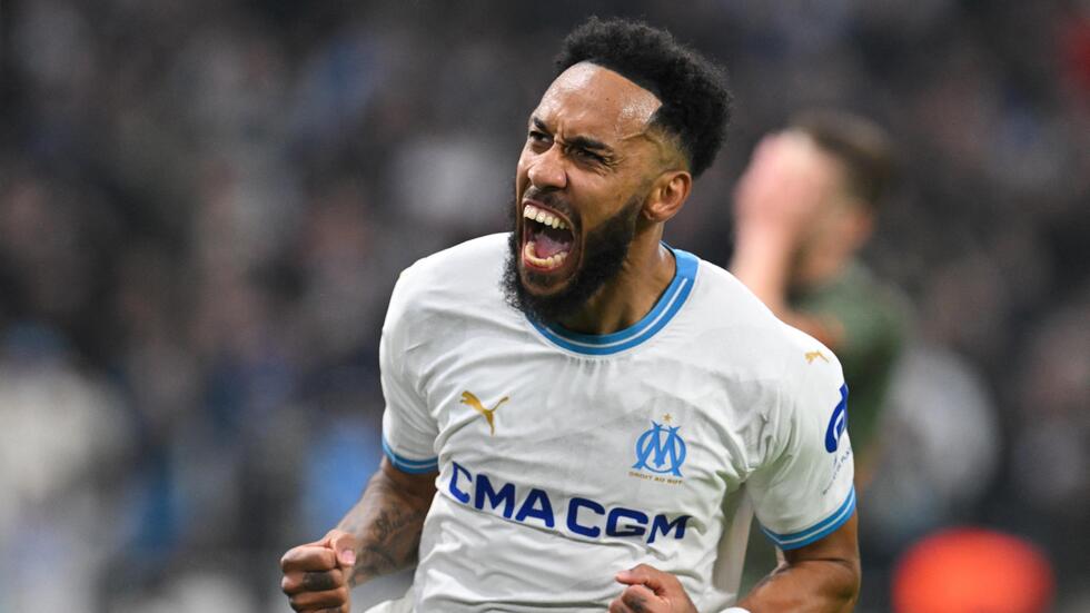 Marseille's French-Gabonese forward #10 Pierre-Emerick Aubameyang celebrates scoring his team's first goal during the UEFA Europa League knockout round play-off second leg football match between Olympique de Marseille and Shakhtar Donetsk at the Velodrome