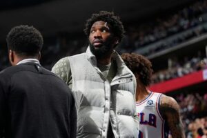 Joel Embiid on the sidelines during a Sixers game