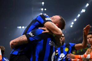 Marko Arnautovic of FC Internazionale celebrates with Lautaro Martinez after scoring their team's first goal during the UEFA Champions League 2023/24 round of 16 first leg match between FC Internazionale and Atletico Madrid