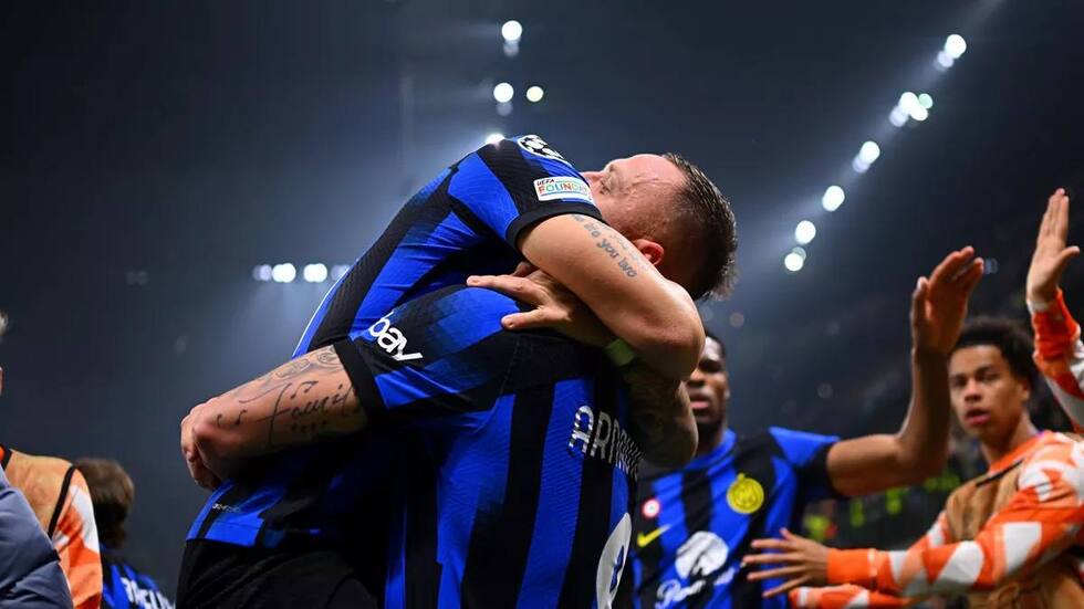 Marko Arnautovic of FC Internazionale celebrates with Lautaro Martinez after scoring their team's first goal during the UEFA Champions League 2023/24 round of 16 first leg match between FC Internazionale and Atletico Madrid