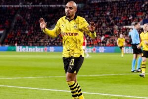 Donyell Malen of Borussia Dortmund scores the 0-1 celebrating his goal during the UEFA Champions League 2023/24 round of 16 first leg match between PSV Eindhoven and Borussia Dortmund