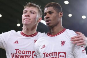 Goalscorers Rasmus Hojlund and Marcus Rashford celebrate at Molineux